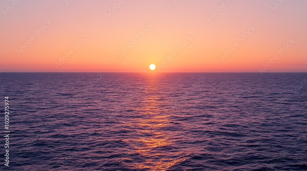 Obraz premium Beautiful sunset on the ocean shore with orange and pink clouds.