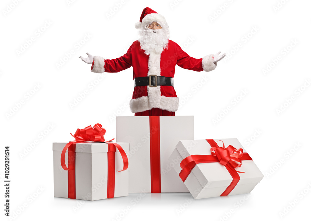 Santa claus standing inside a big gift box Santa claus standing inside a big gift box