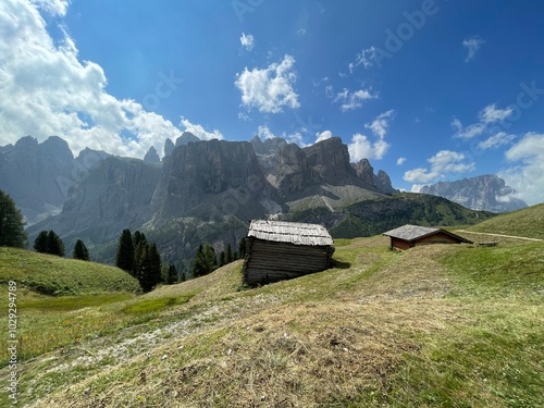 Mountain hut over Colfosco, Calfusch and panoramic view of Gruppo del Sella, Sellagruppe in Alta Badia Valley, Dolomites , Trentino, Alto Adige, Sudtirol, South Tyrol, Italy photo