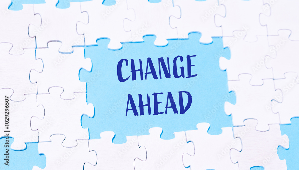 Fototapeta premium A puzzle with the word change ahead written in blue