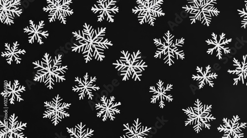 Small snowflakes in focus and not on the black