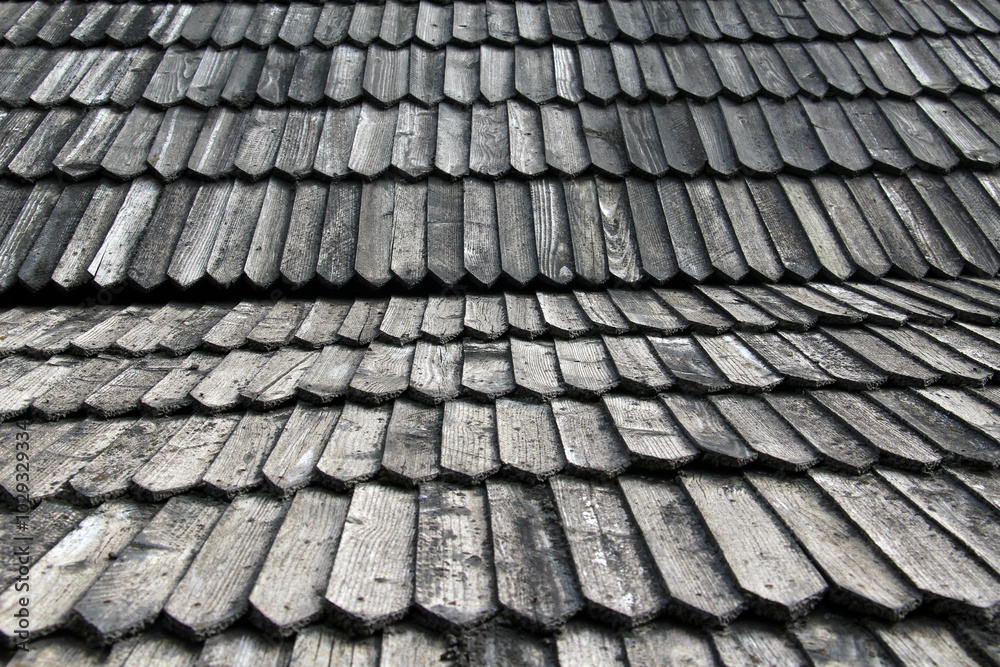 The old building is covered with wooden tiles The old building is covered with wooden tiles