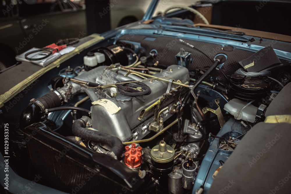 Engine under the bonnet of a classic motor which undergoing full restoration Engine under the bonnet of a classic motor which undergoing full restoration