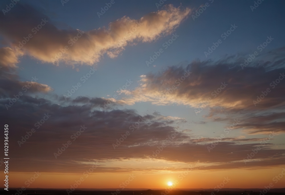 The sun sets over the ocean, its rays reflecting in calm water The sun sets over the ocean, its rays reflecting in calm water