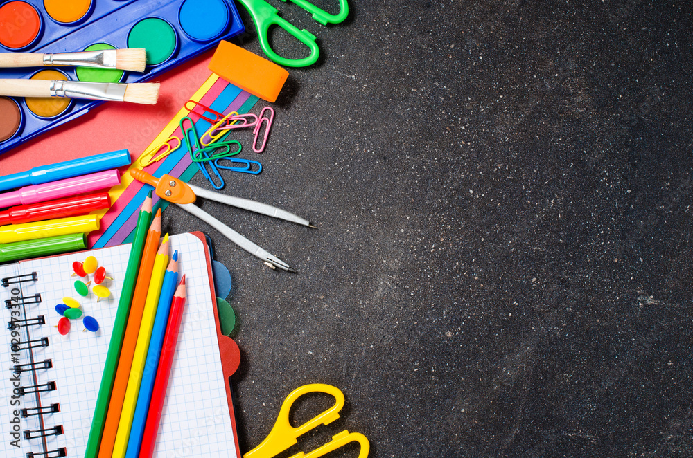 School supplies on dark table