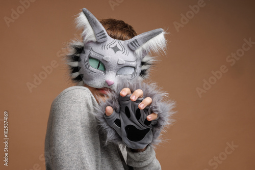 quadrobics portrait, Teenager in cat mask on beige background, studio photo, photo
