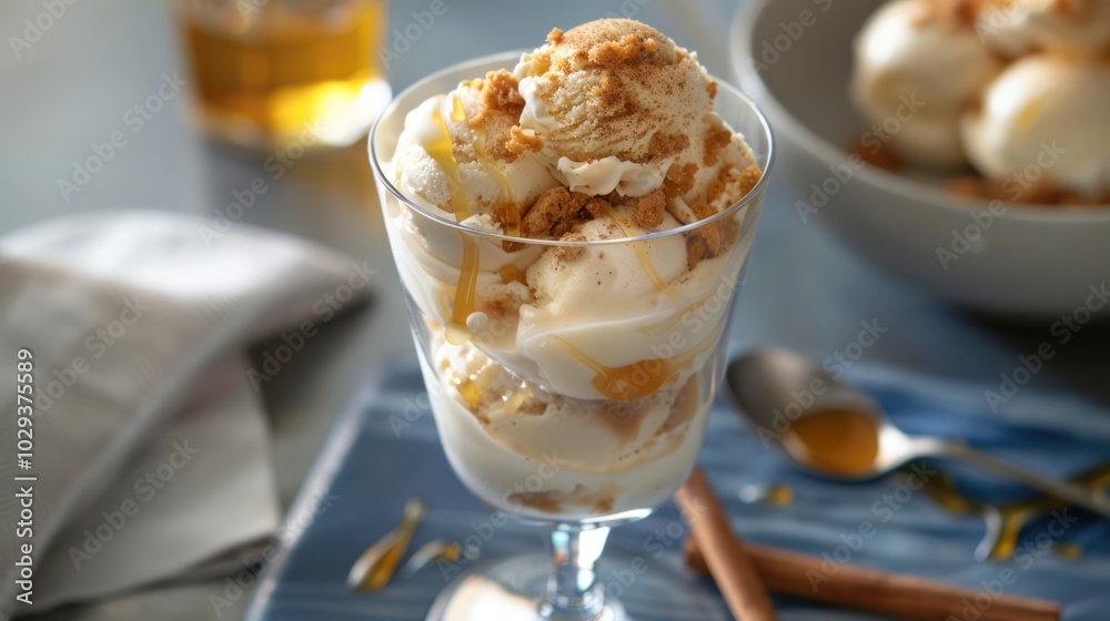 Ice Cream Sundae with Honey and Crumble Topping in Glass Ice Cream Sundae with Honey and Crumble Topping in Glass
