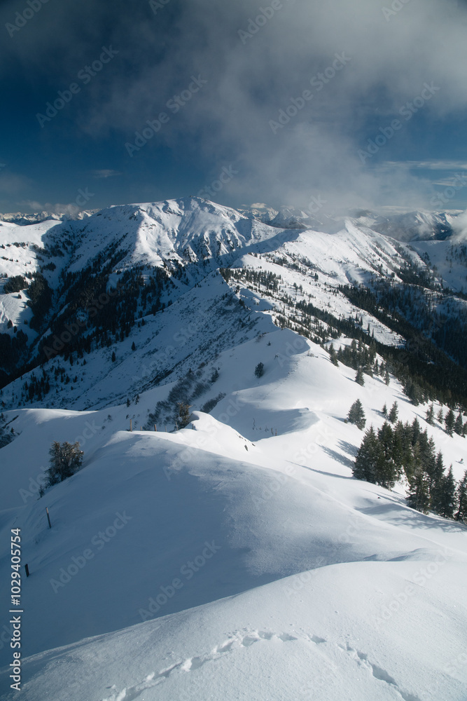 Winter alpine mountain scenery with snow ridge