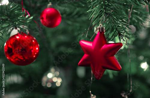 Christmas and New Years background with fir tree and red decoration.