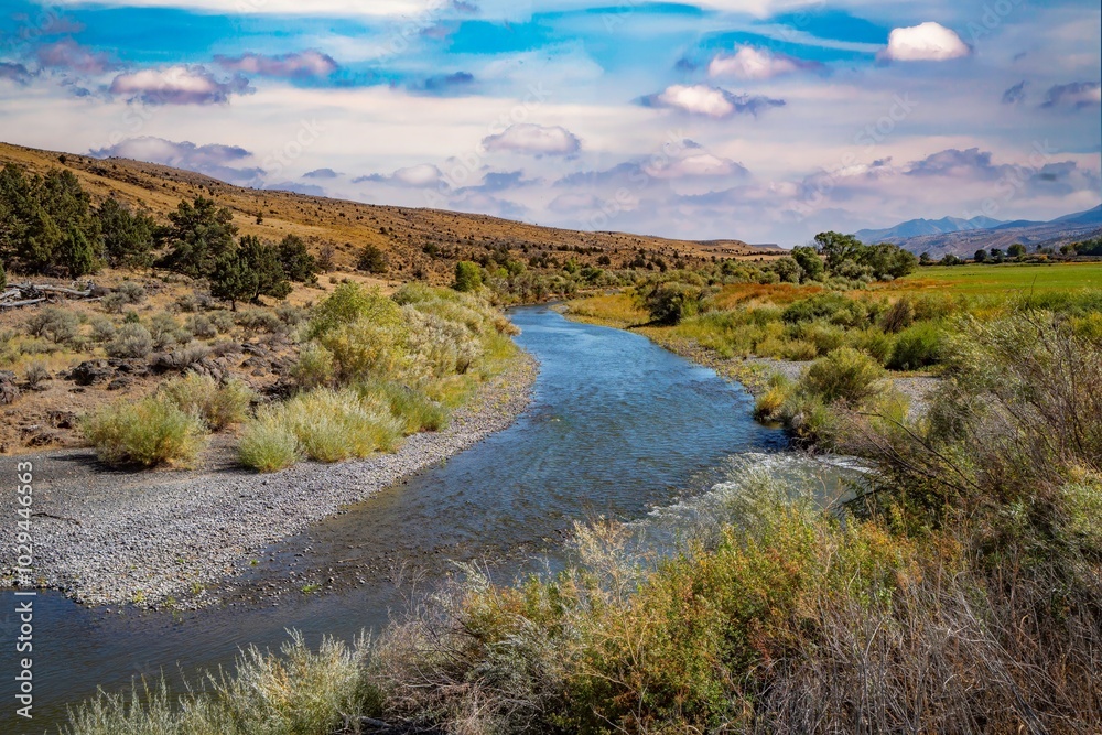 The John day River winds througfh sage brush and agricultural land just west of Dayville Oregon The John day River winds througfh sage brush and agricultural land just west of Dayville Oregon