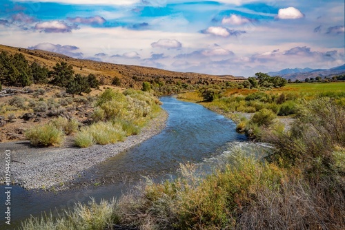 The John day River winds througfh sage brush and agricultural land just west of Dayville Oregon