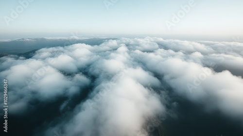 Fototapeta Naklejka Na Ścianę i Meble -  A mesmerizing view of the sky filled with thick, fluffy white clouds that stretch endlessly across the horizon, capturing the beauty and vastness of nature’s sky canvas.