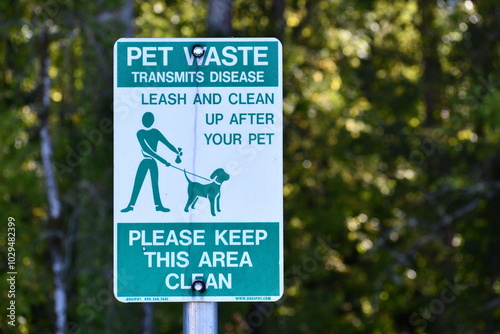 Pet waste station sign. Reads: Pet waste transmits disease.