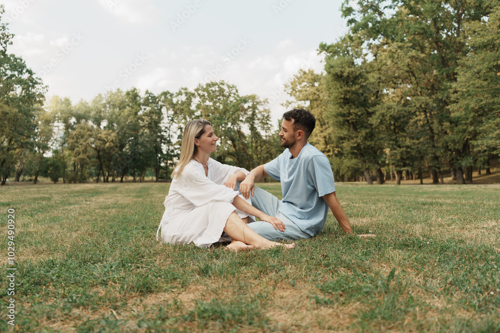 Couple enjoying a peaceful conversation outdoors in a sunny park Couple enjoying a peaceful conversation outdoors in a sunny park