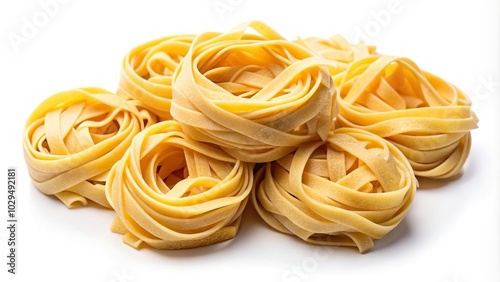 Uncooked durum fettuccine pasta isolated on white background, raw spaghetti, noodles