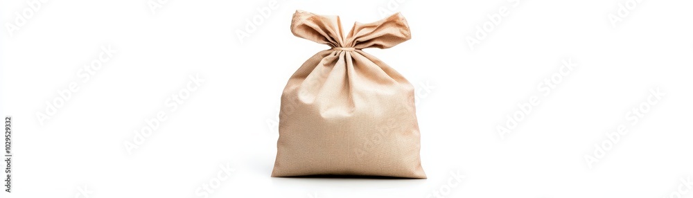 Simple beige cloth bag tied at the top on a white background. Simple beige cloth bag tied at the top on a white background.