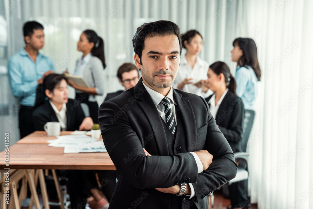 Portrait of happy businessman looking at camera with motion blur background of business people movement in dynamic business meeting. Habiliment Portrait of happy businessman looking at camera with motion blur background of business people movement in dynamic business meeting. Habiliment