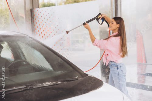 Young Woman Cleaning Car at Self-Service Car Wash