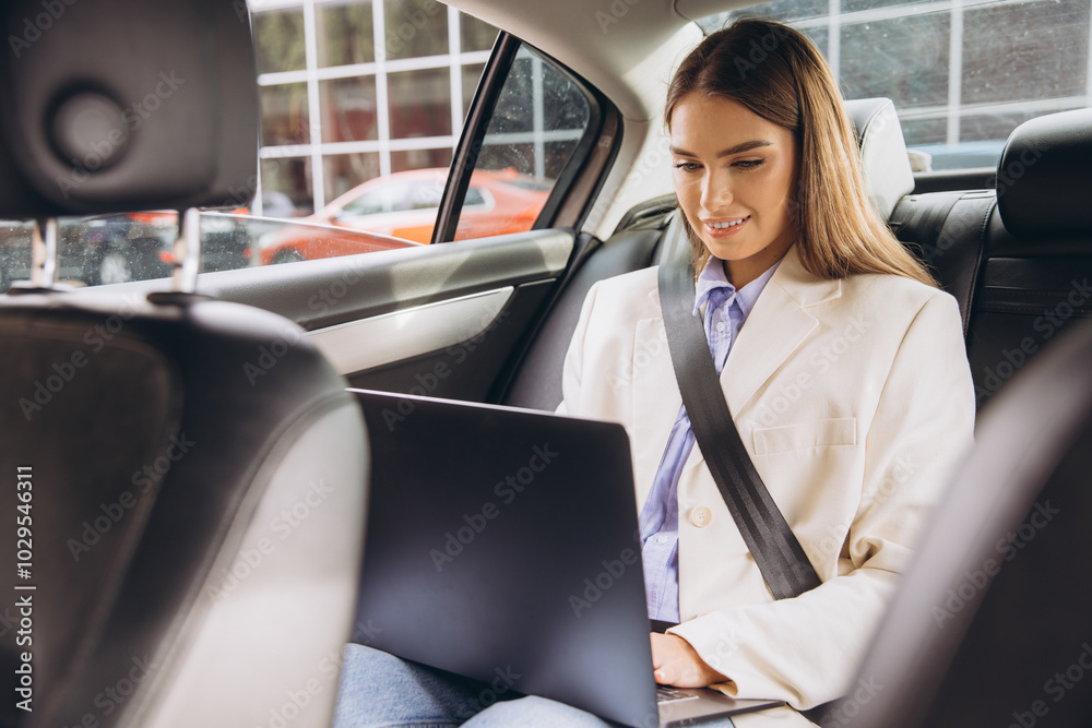 Businesswoman Working Remotely in Car with Laptop on the Go Businesswoman Working Remotely in Car with Laptop on the Go