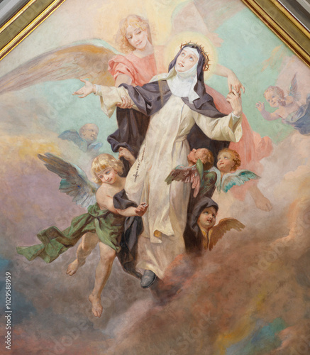 VOGHERA, ITALY - SEPTEMBER 12, 2024: The ceiling fresco of Apotheosis of Therese of Avila from side nave of Domo - Collegiata di San Lorenzo by Luigi Morgari (1906 - 1908).