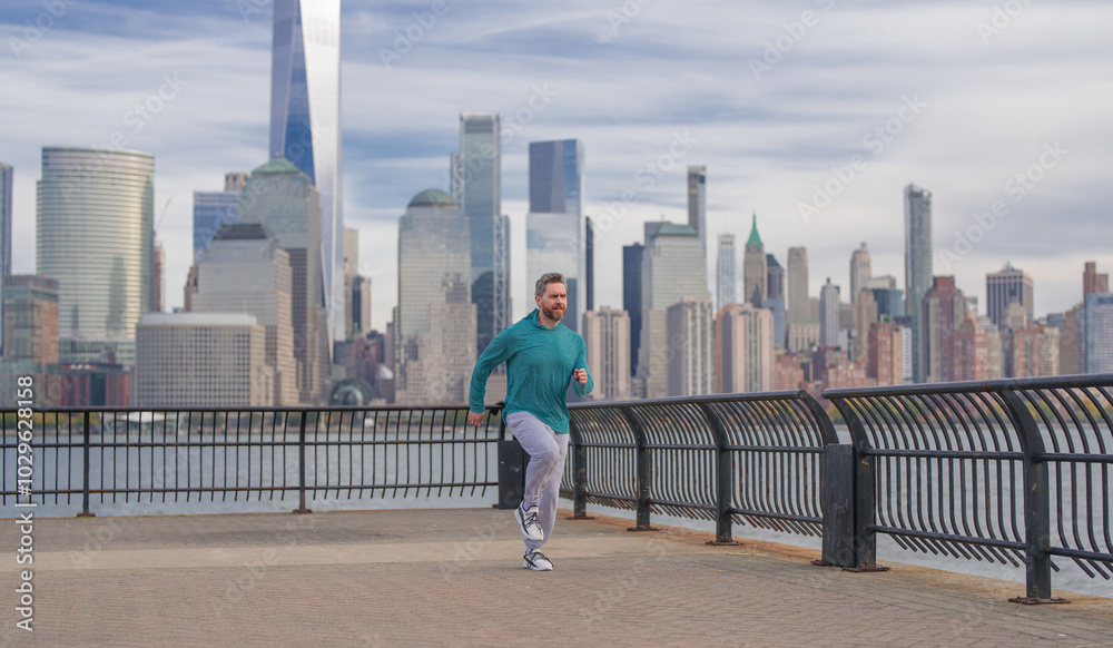 Hispanic Man runner in sport outfit run in NYC. Motion, healthy run. Jogger run near Manhattan downtown. Muscular athlete sportsman run in city. Running sportswear. Handsome guy running workout Hispanic Man runner in sport outfit run in NYC. Motion, healthy run. Jogger run near Manhattan downtown. Muscular athlete sportsman run in city. Running sportswear. Handsome guy running workout