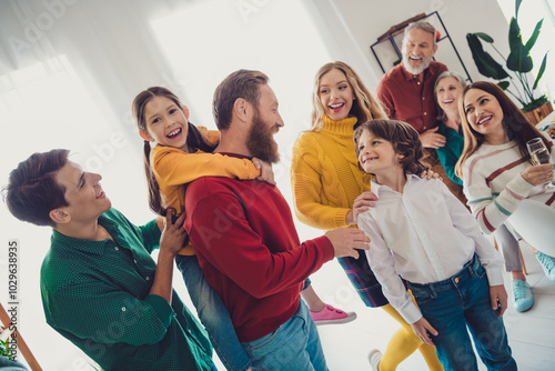 Photo of friendly sweet family play together have fun piggyback eating holiday dinner smiling hugging indoors house room