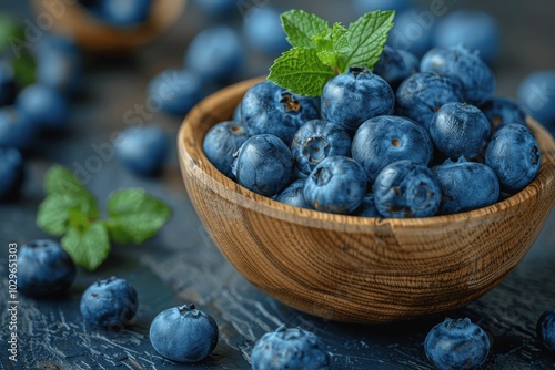 Wallpaper Mural Rustic wooden bowl with fresh blueberries and mint leaves on dark background close up Torontodigital.ca