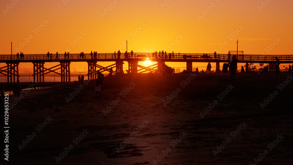 Silhouette of people at the pier during sunset copy space Silhouette of people at the pier during sunset copy space
