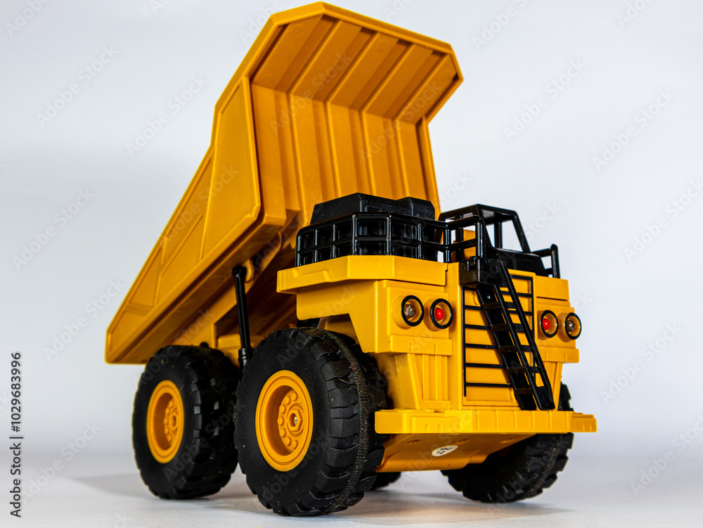 Obraz premium Yellow Mining Truck Model - Realistic Details on White Background
