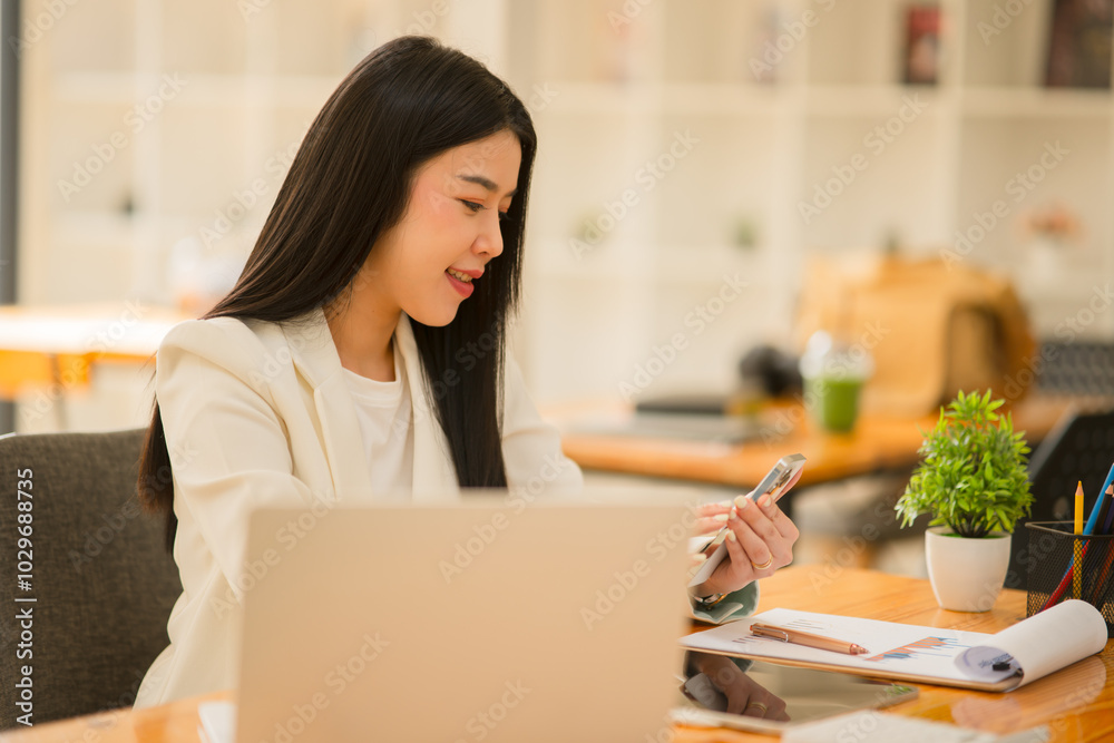 business women sitting and working Documents in front of the computer
business women sitting and working Documents in front of the computer