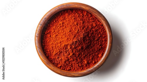 Red paprika powder in a bowl isolated on white background.