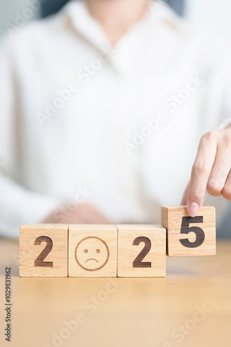 Happy New Year 2025 with Sad face block. Satisfaction, feedback, Review, mental health, eco sustainable and bad year concept