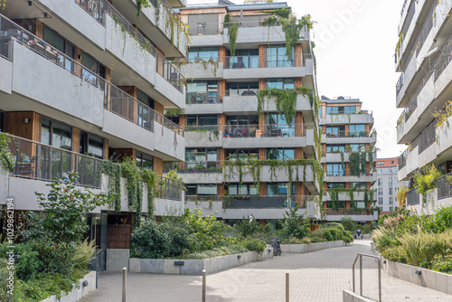 Photos Modern apartment building with a lot of greens and a concrete facade seen in Ber