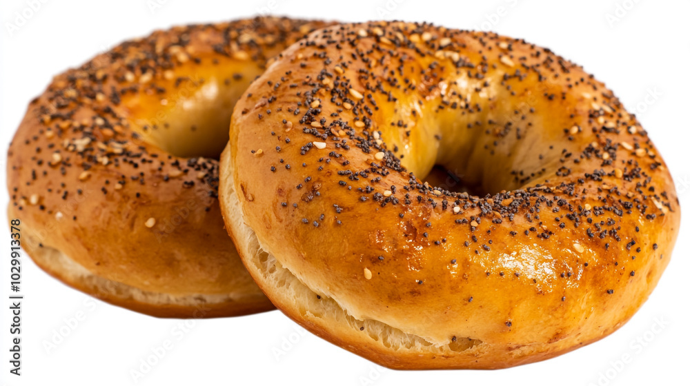 Freshly baked poppy seed bagels on a plain surface ready for breakfast or snack time Freshly baked poppy seed bagels on a plain surface ready for breakfast or snack time