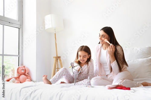 Happy mother with her littl...