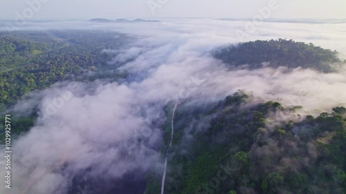 Fly over clouds and river, mountain tops, Afobaka Brokopondo Suriname photo