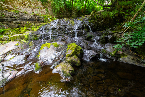 The main Fairy Falls Rhaeadr y Tylwyth Teg in Welsh, in the village of Trefriw. Low in Summer. photo