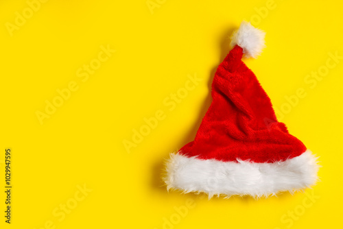 Santa Claus hat on yellow background