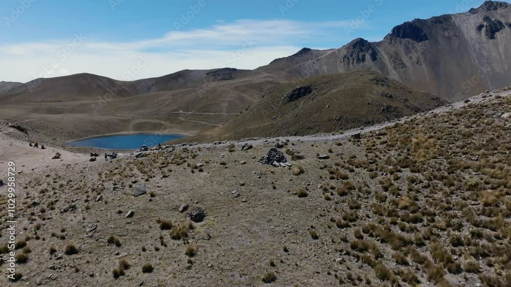 Aerial establishing shot of Laguna del la Luna inside volcano crater. Sunny day in summer showing spectacular mountain landscape of Mexico National park. Wide shot. Aerial establishing shot of Laguna del la Luna inside volcano crater. Sunny day in summer showing spectacular mountain landscape of Mexico National park. Wide shot.