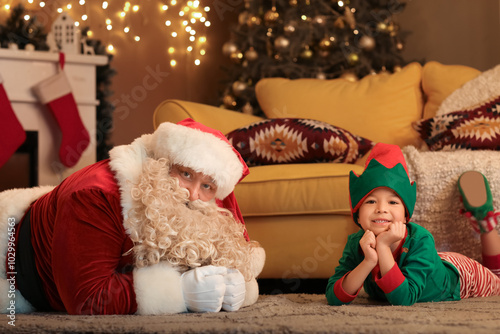 Santa Claus with cute littl...