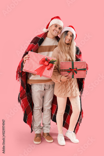 Happy young couple in Santa...
