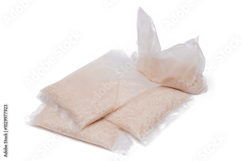 A Plastic Bags of White Long Grain Rice - Isolated on White Background. Small Transparent Packages with Dry Rice - Isolation