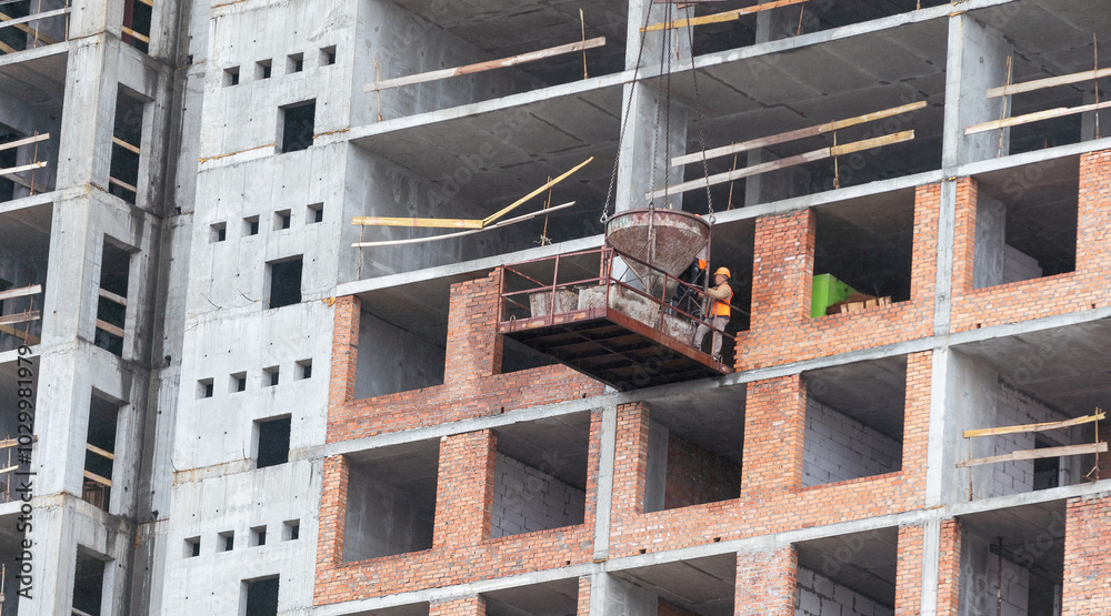 Construction of apartment buildings, dense urban development. The process of construction of residential buildings. Construction of apartment buildings, dense urban development. The process of construction of residential buildings.