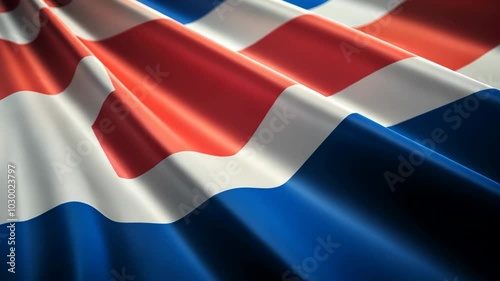 The red, white, and blue flag of Iceland billows in the wind