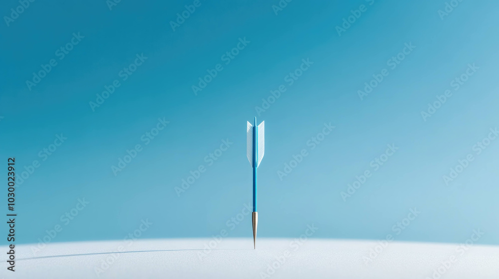 blue arrow with metallic tip stands upright against serene blue background, symbolizing precision and focus. simplicity of image evokes sense of calm and determination blue arrow with metallic tip stands upright against serene blue background, symbolizing precision and focus. simplicity of image evokes sense of calm and determination