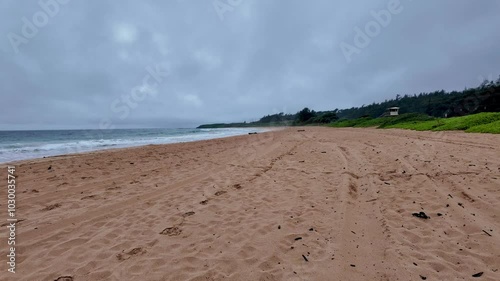 Red sand beach at Ke ala hele makalae path near Kaiakea Point in Kauai Hawaii. Morning Sunrise view by the beach in Kauai Hawaii. Beautiful cloudscape over the sea, view from a Kauai Beach photo