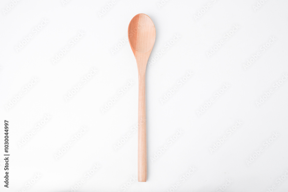 Close-up photo of wooden table spoon isolated on white background. High angle, Flat Lay Setup. Close-up photo of wooden table spoon isolated on white background. High angle, Flat Lay Setup.