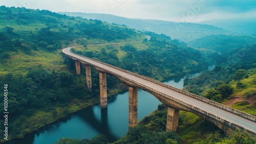 Elevated bridge winding through lush green hills over river