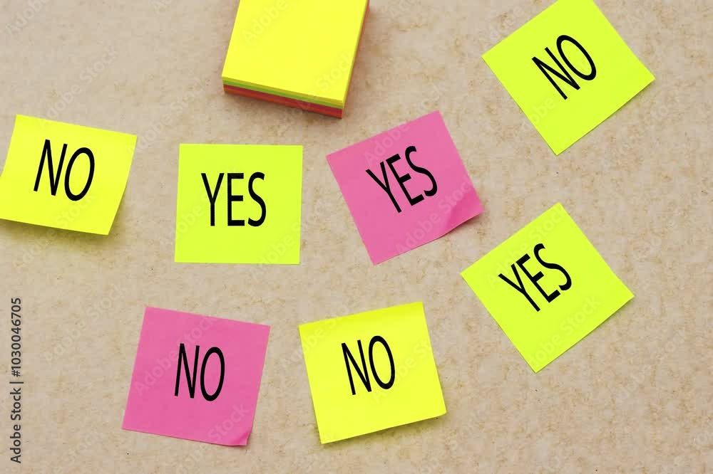 yes and no on colorful sticky note on beige background yes and no on colorful sticky note on beige background