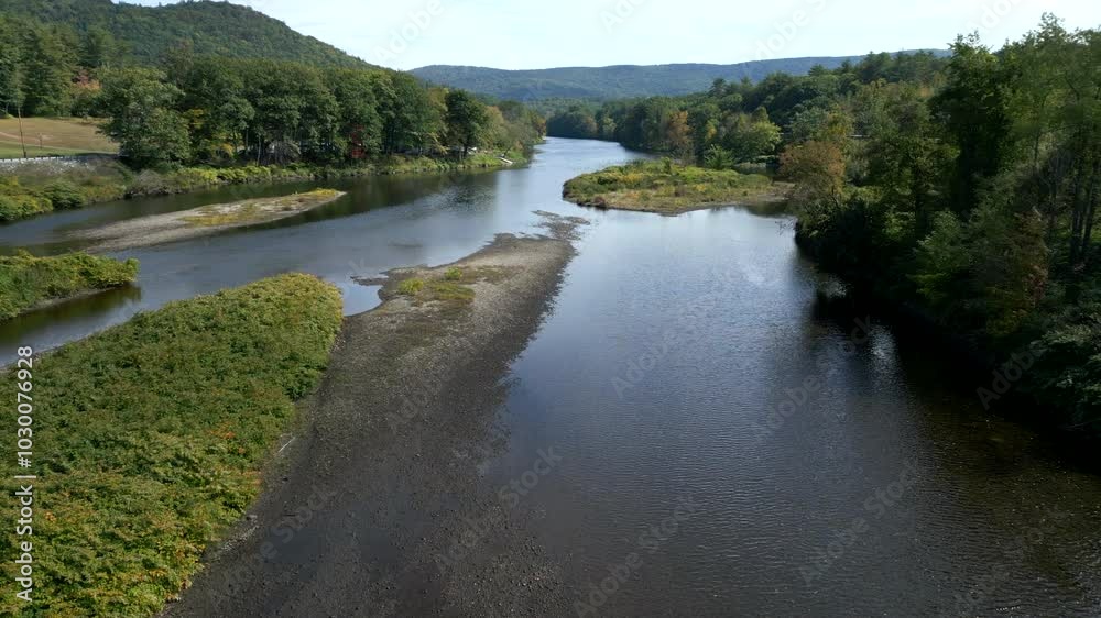 Aerial dolly soars above Mohawk Trail by Deerfield River in Western Massachusetts New England USA Aerial dolly soars above Mohawk Trail by Deerfield River in Western Massachusetts New England USA